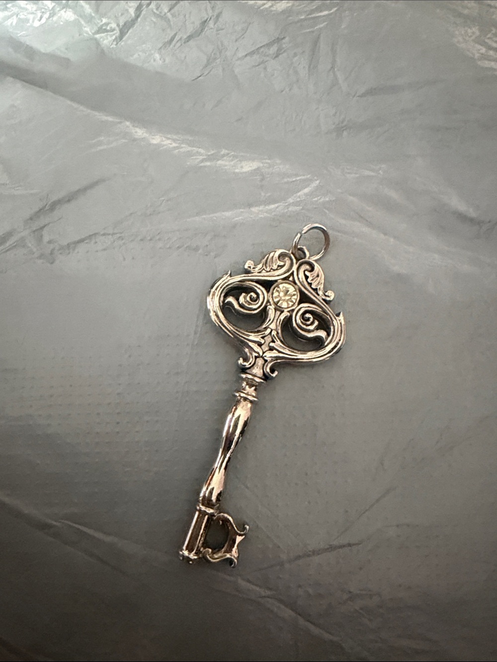 Ornate Silver Key Chain with Clear Stone